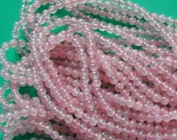 Wholesale import healing stone crystal suppliers presentung smooth rounded pinky genuine rose quartz beads. Rose quartz has the property of emotional balance. It is very good for expressing and soothing emotions. 