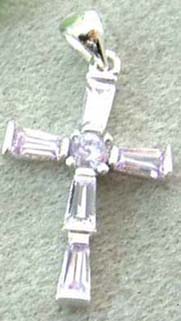 Direct import zirconia set cross pendant online wholesale light purple cz embedded zirconia cross pendant with a rounded cz stone inlay at centre. An ancient cross of Celtic origin encircled by Viking runes. 