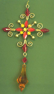Wearable art online manufacturers wholesale supply Celtic floral cross pendant with red beads. Ancentral cut-out flower symbolizing eternity is woven with the protective design of the Celtic goddess Bridhe, also known as St. Bridget, and is reputed to keep the wearer safe and secure.